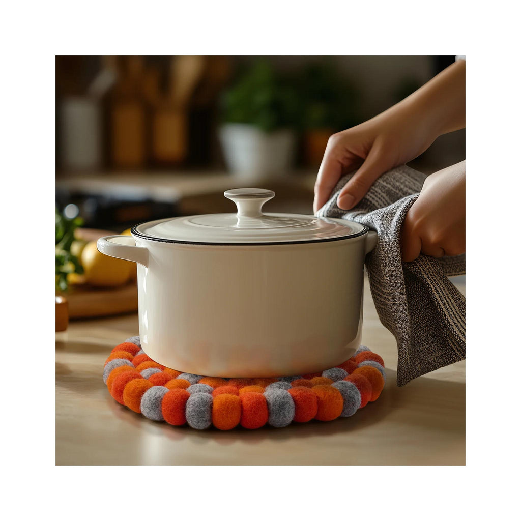 ModWool Felt Ball Trivets - Orange/Grey in use