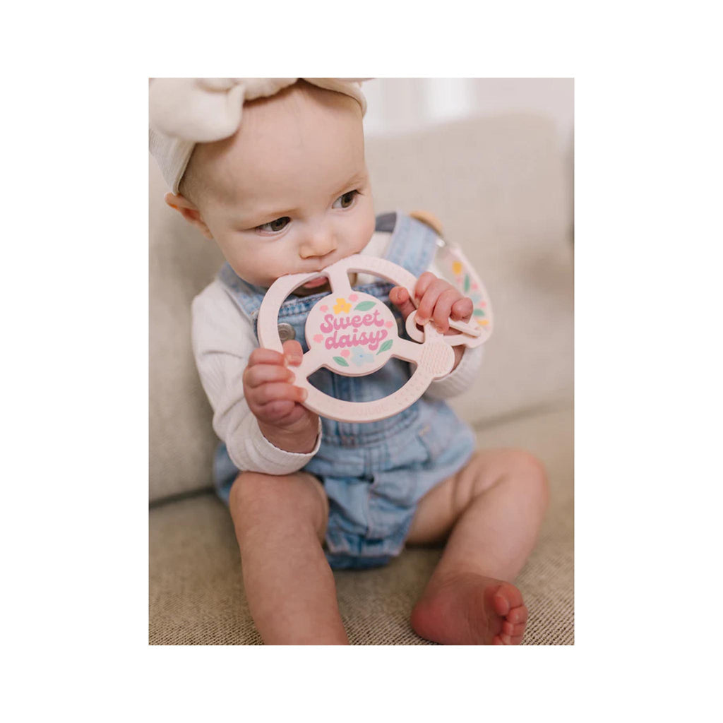 JuJuBe Silicone Teether Ring with Detachable Clip - Sweet Daisy - in use