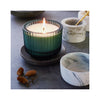 Roland Pine 6 oz Ribbed Glass Candle - in use