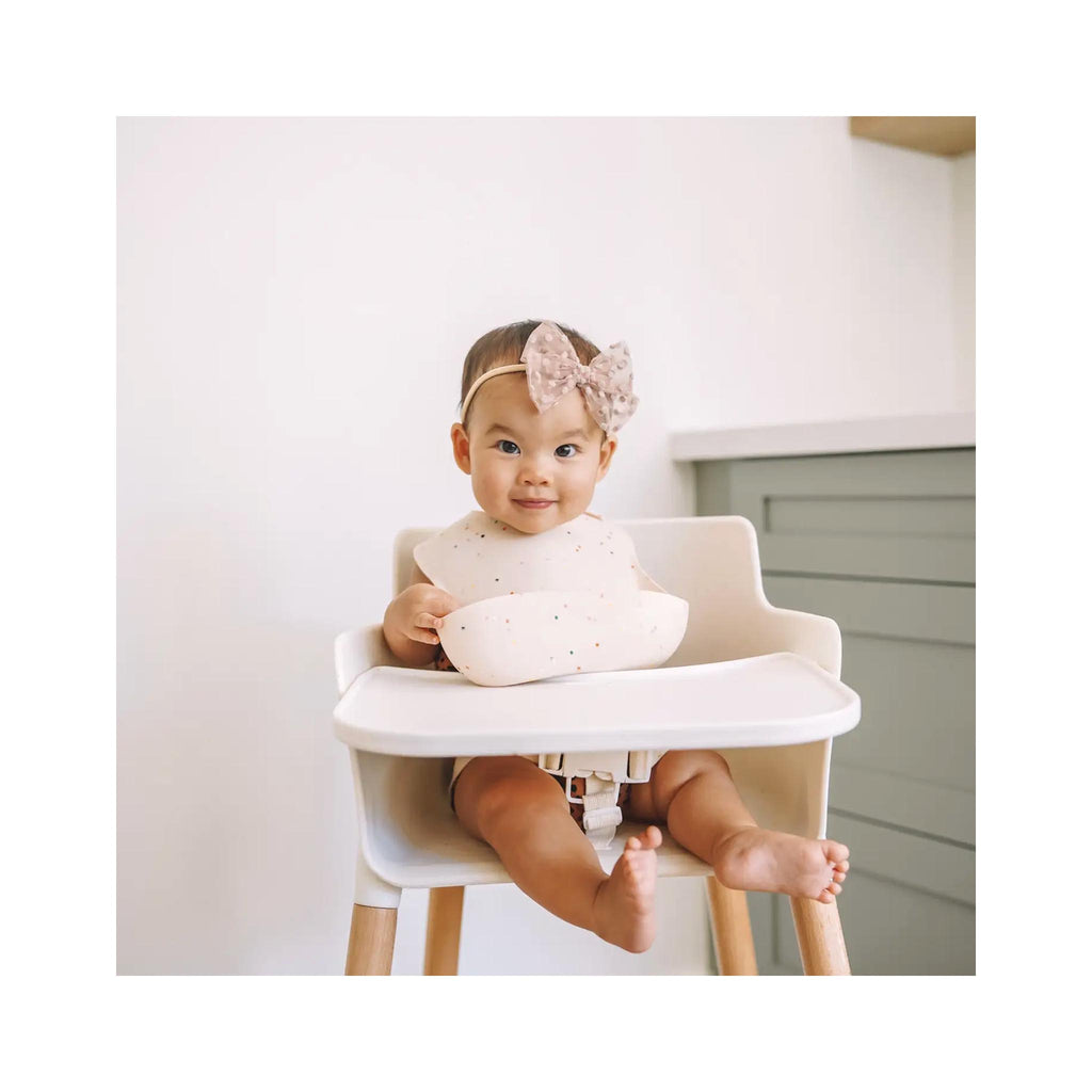 Ava + Oliver Confetti Silicone Baby Bibs - Coconut on baby